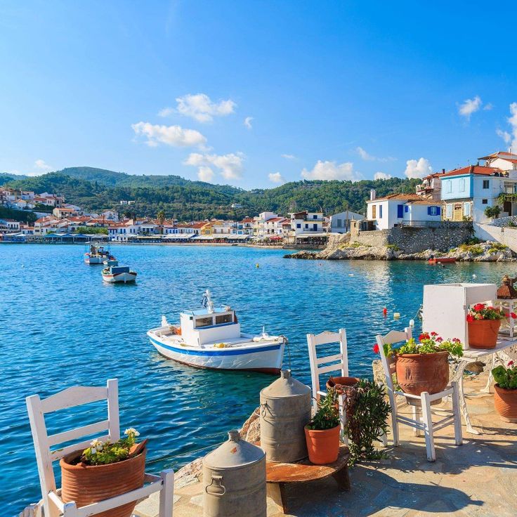 Kokkari fishing harbor with traditional boats and mountain backdrop
