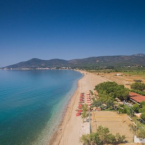 Potokaki Beach with its endless golden sand coastline and azure waters